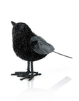 Black decorative raven on a white background