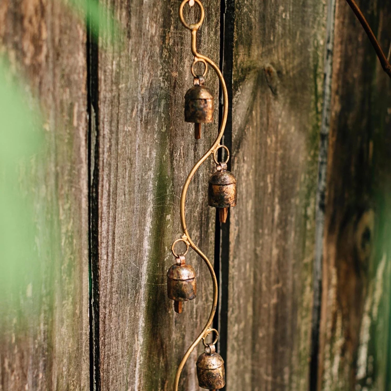 Decorative hanging bells on a wooden surface