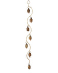 Decorative hanging with bronze bells on a white background
