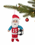 Decorative ornament of a soccer-themed Santa Claus hanging on a Christmas tree