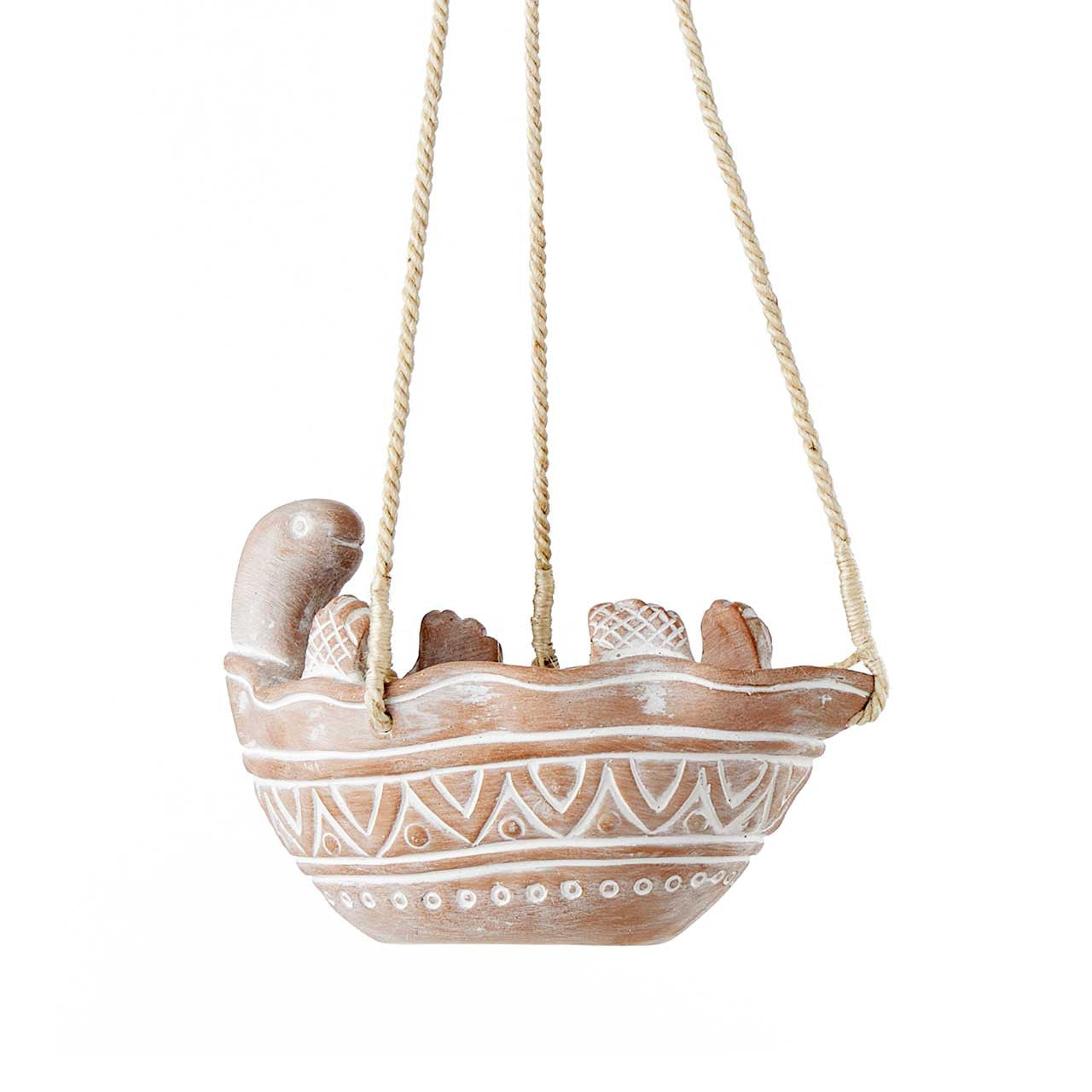 Decorative turtle hanging planter on a white background