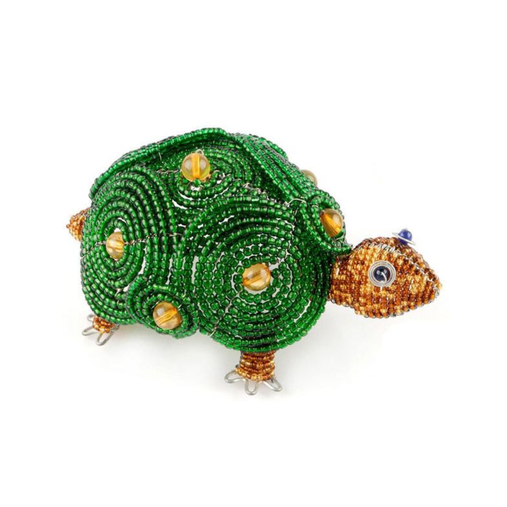 Beaded turtle figurine with green shell and brown body on a white background