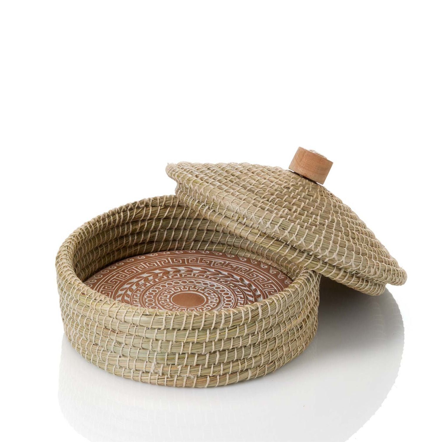 Woven basket and bread warmer with a lid on a white background