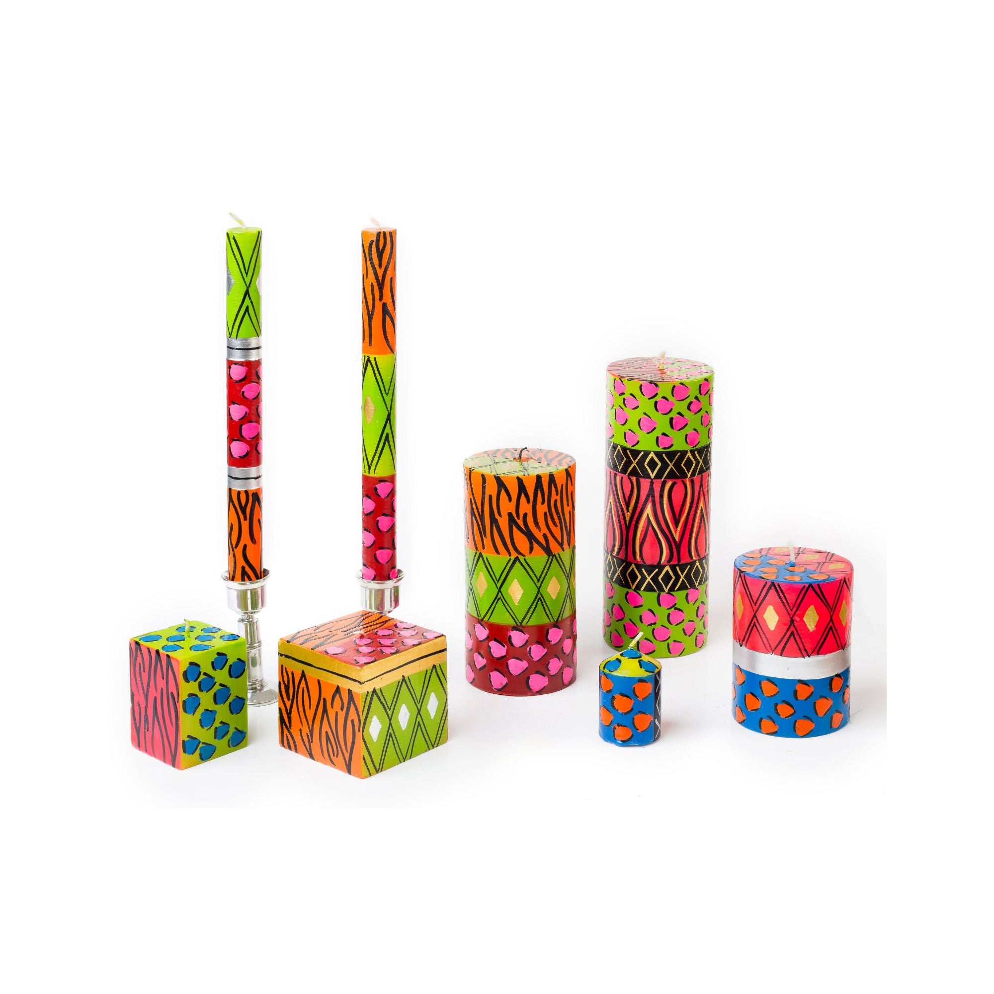 Colorful animal print candles with various patterns on a white background
