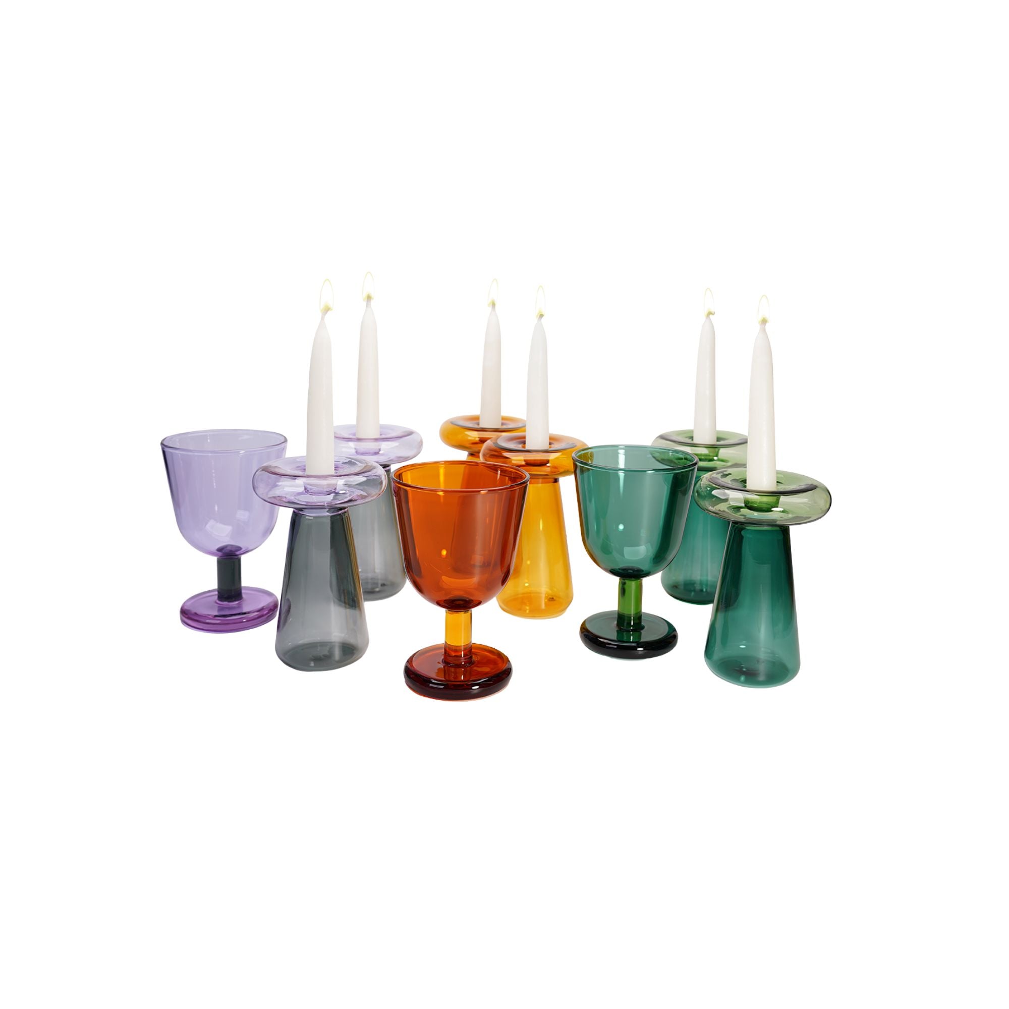 Colorful glassware with candles on a white background