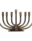 Iron menorah with eight candles on a white background