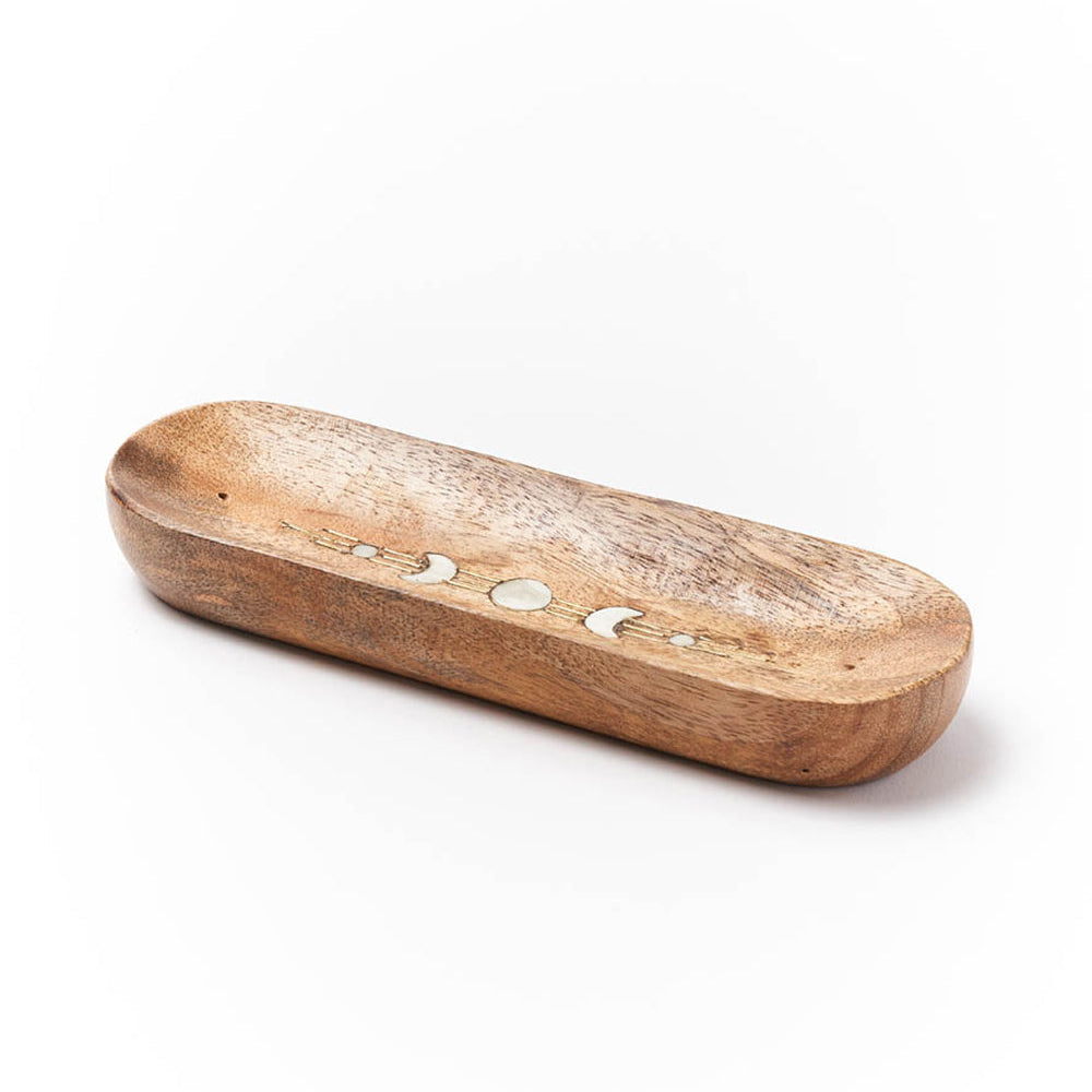 Wooden incense holder with decorative moon design on a white background