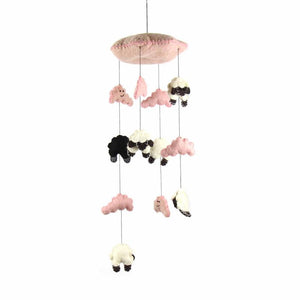 A pink and black hand-felted mobile with sheep and clouds, designed for baby cribs.