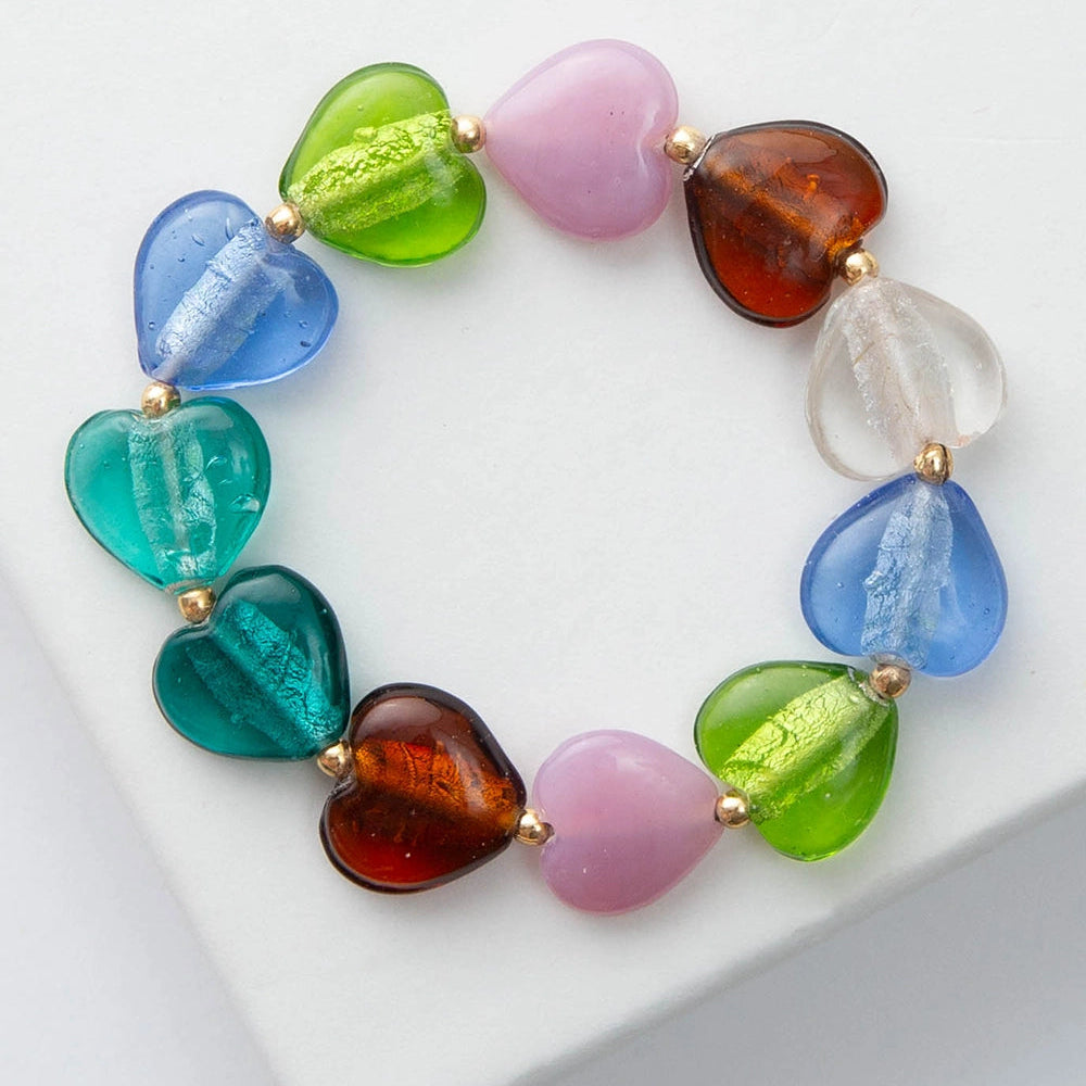 Multicolored glass beaded bracelet on a white surface