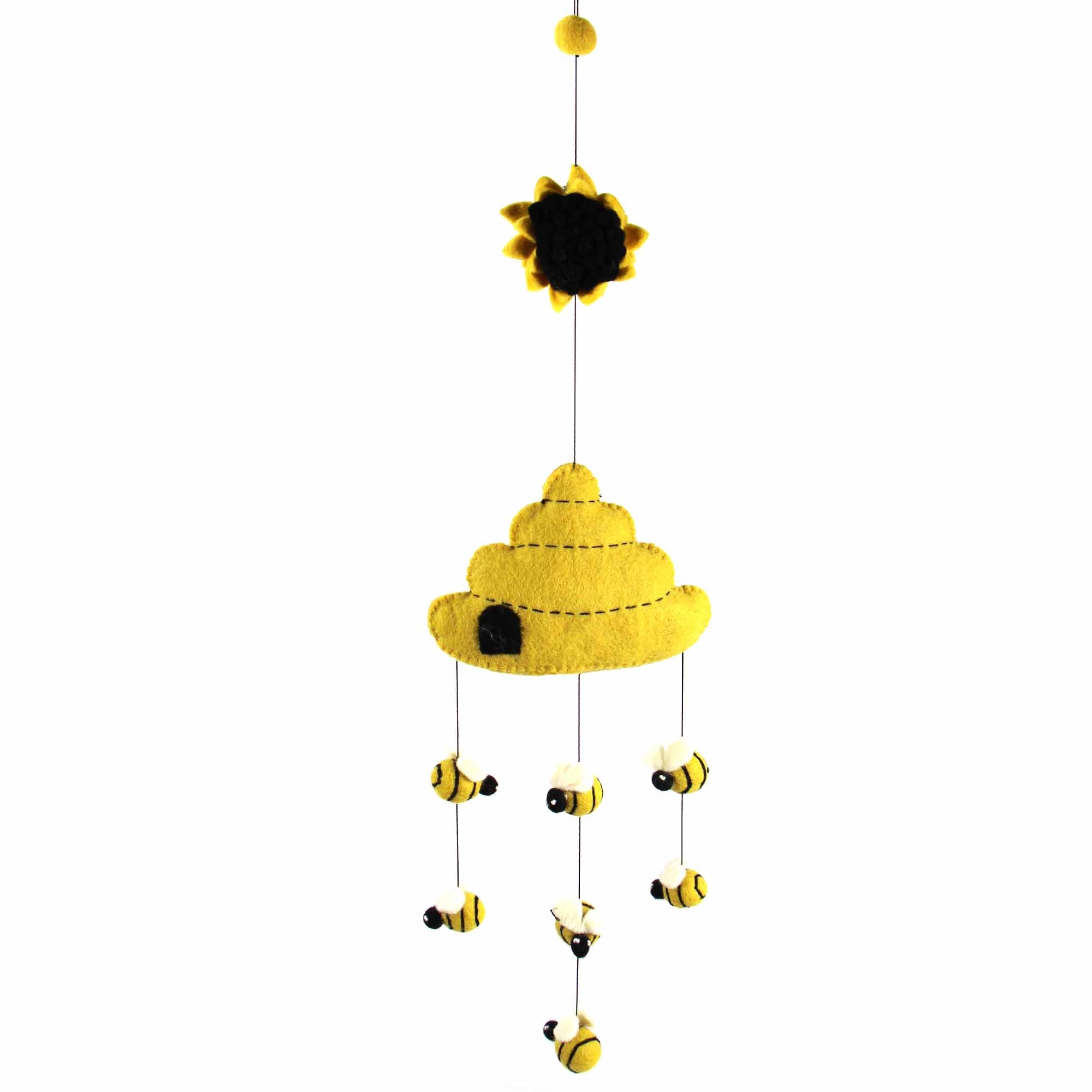 A handmade felt mobile featuring a beehive with bees buzzing around, in yellow, black, and white colors, with a sun and moon at the top.