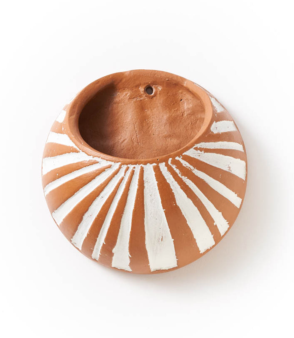 Ceramic bowl with sunburst design on a white background