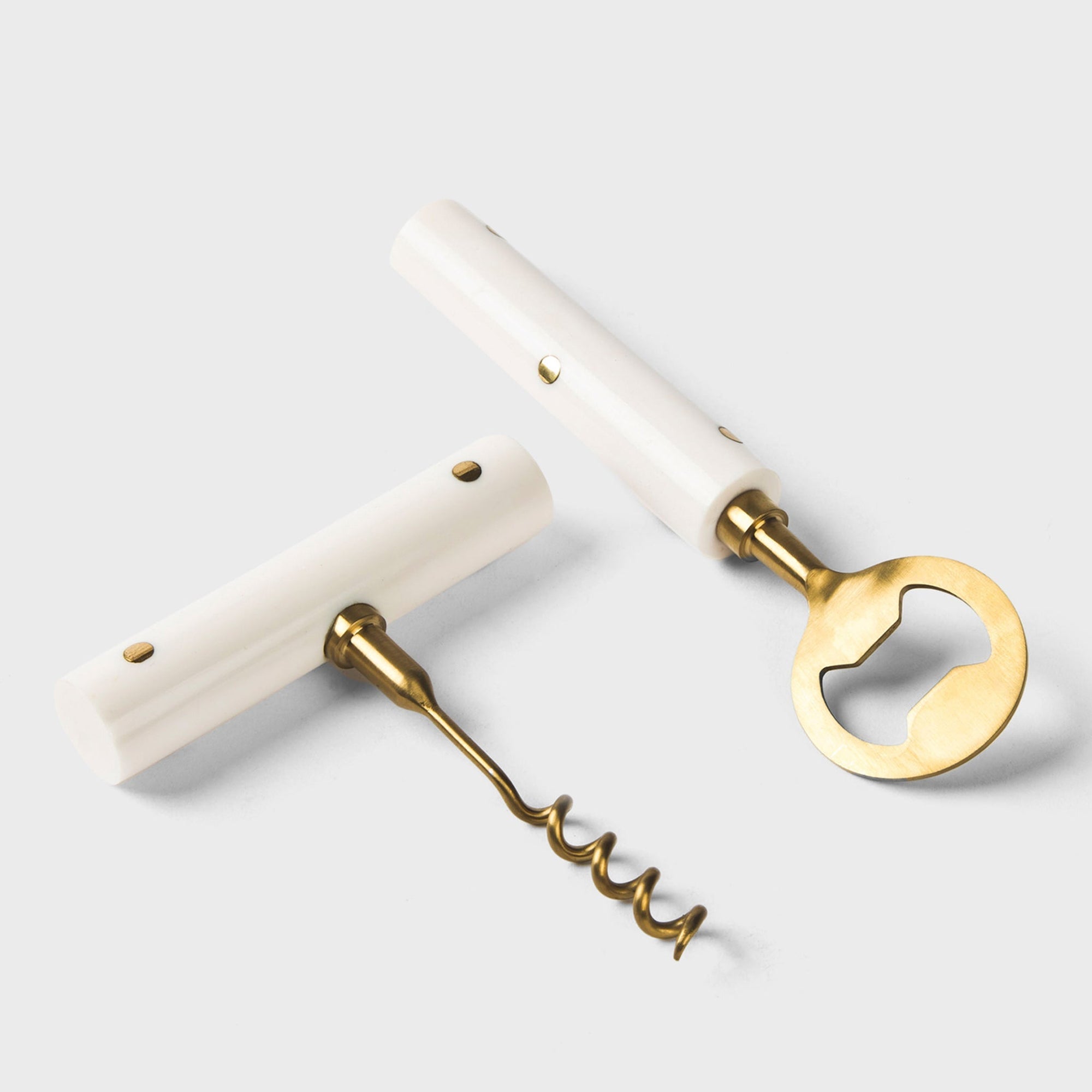 Corkscrew with marble handle on a light gray background