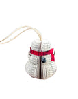 Decorative paper snowman ornament with a red band and black button on a white background
