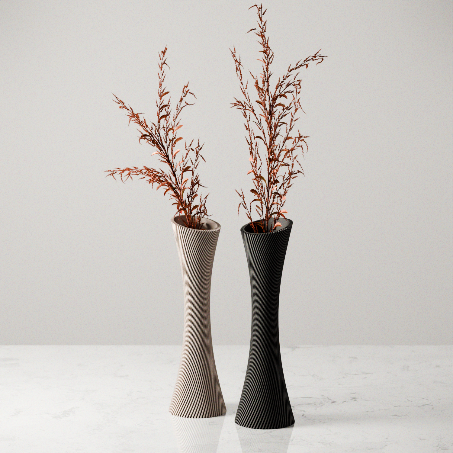 Two tall vases with textured designs and dried plants on a light background
