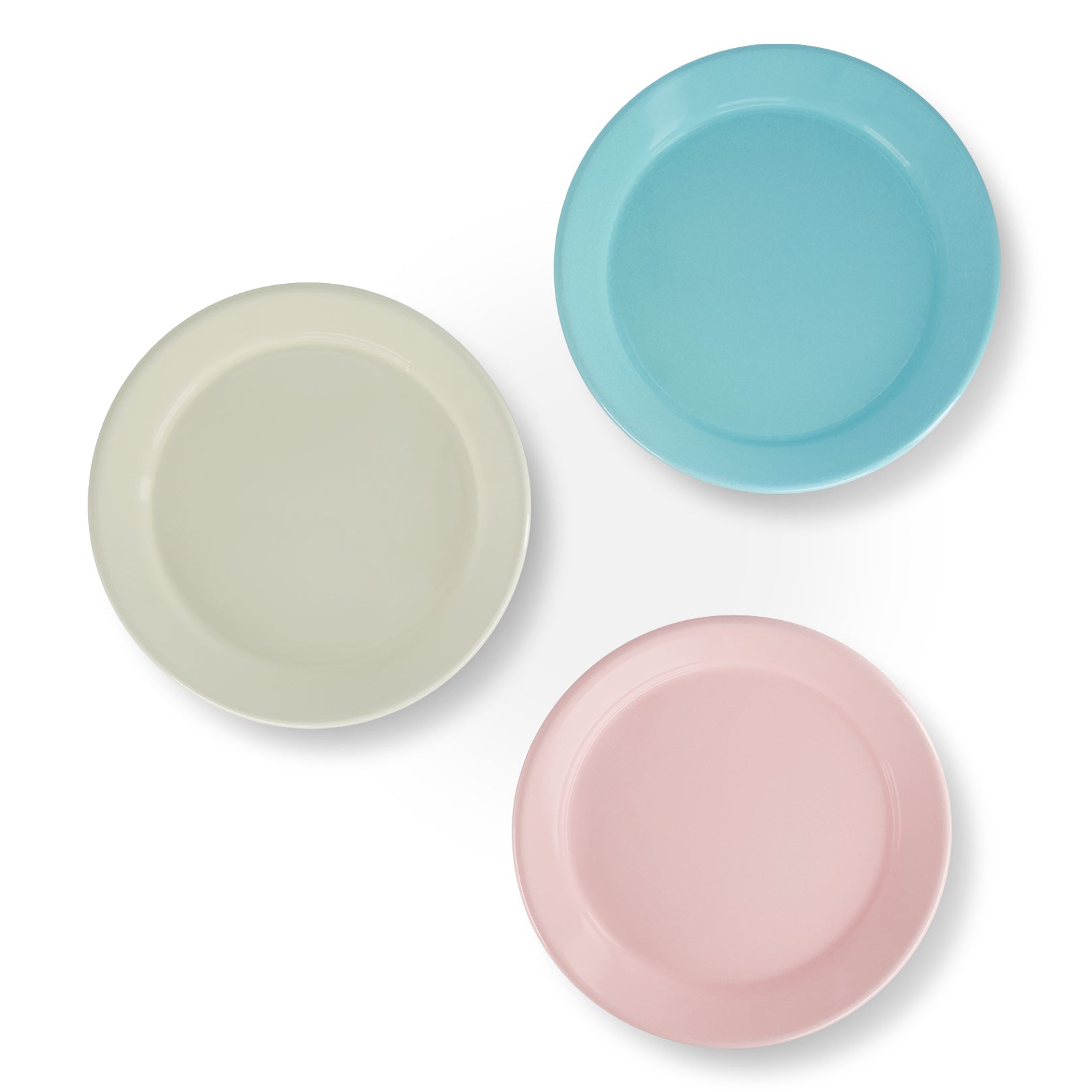 Three ceramic plates in pastel colors on a white background
