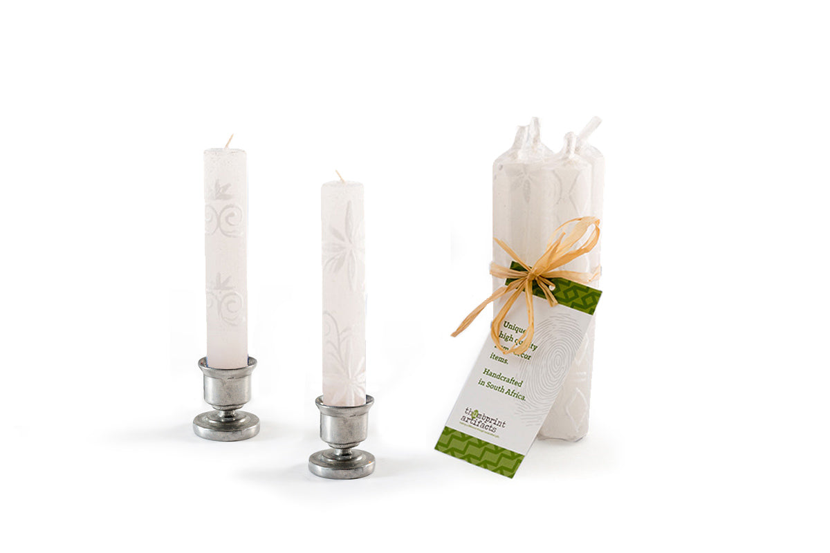 Set of shabbat candles with decorative packaging on a white background