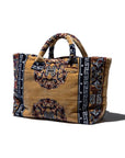 Decorative fabric rug tote bag with patterned design on a white background