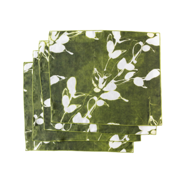 Set of green placemats with white floral pattern on a white background