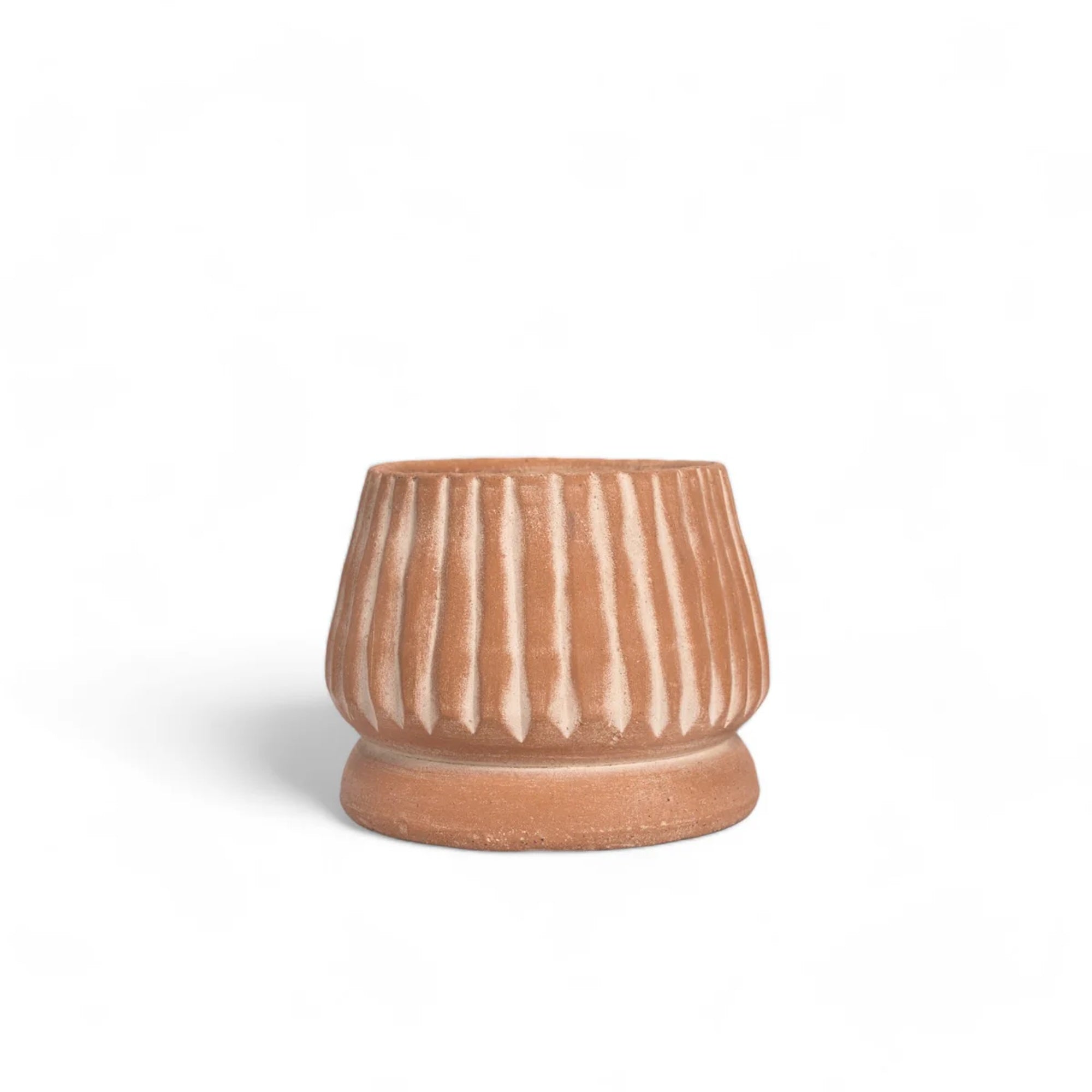 Ceramic pot with striped design on a white background