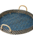 Round woven tray with blue center and natural handles on a white background
