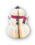Recycled paper snowman decoration with a red and black plaid paper scarf on a white background