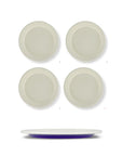 Set of four ceramic plates with a blue rim on a white background