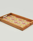 Wooden tray with floral fabric insert on a light gray background