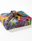 Colorful floral-patterned fabric wrapped around a box on a white background
