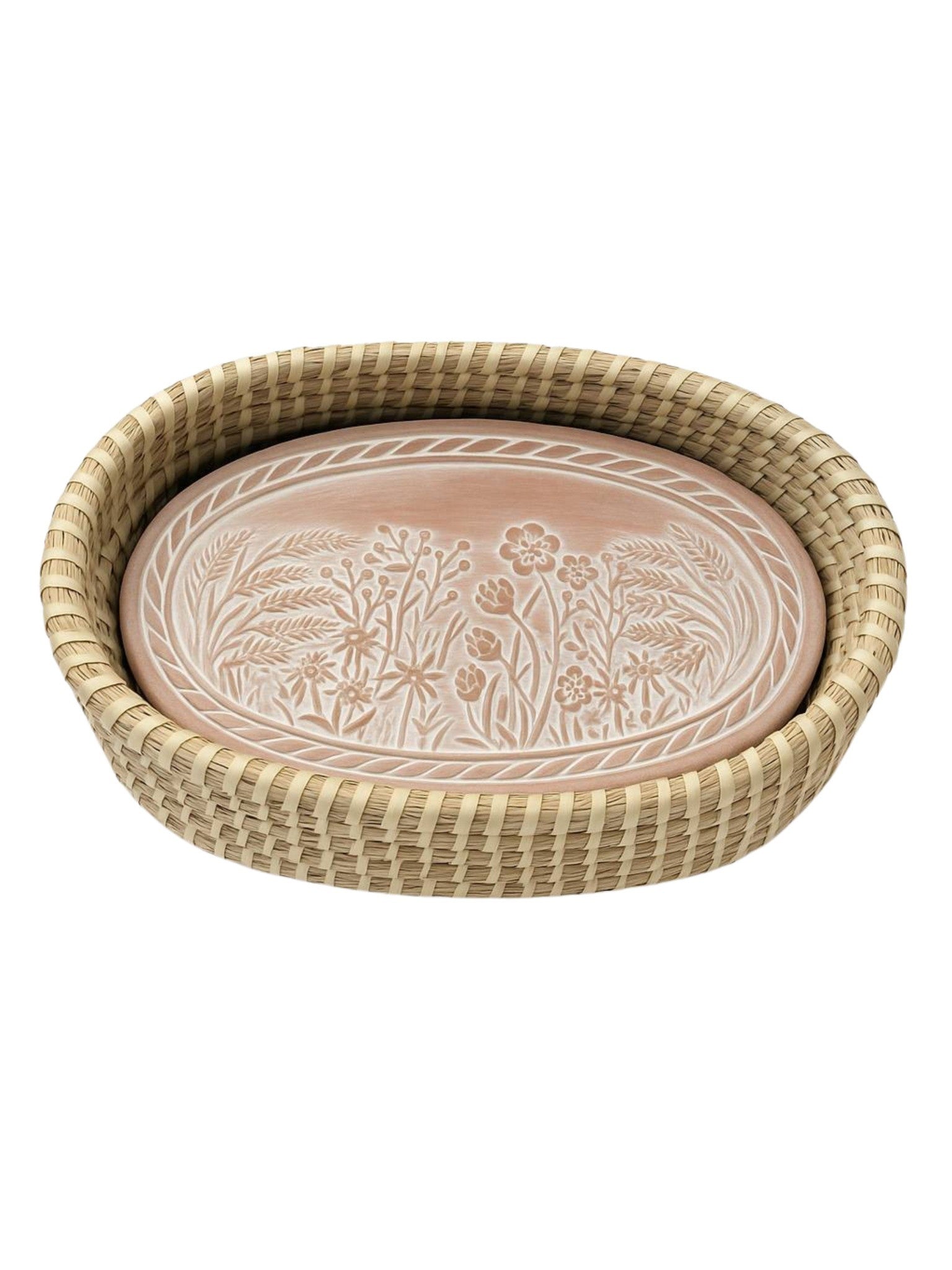 Round woven bread basket with a decorative ceramic plate inside on a white background
