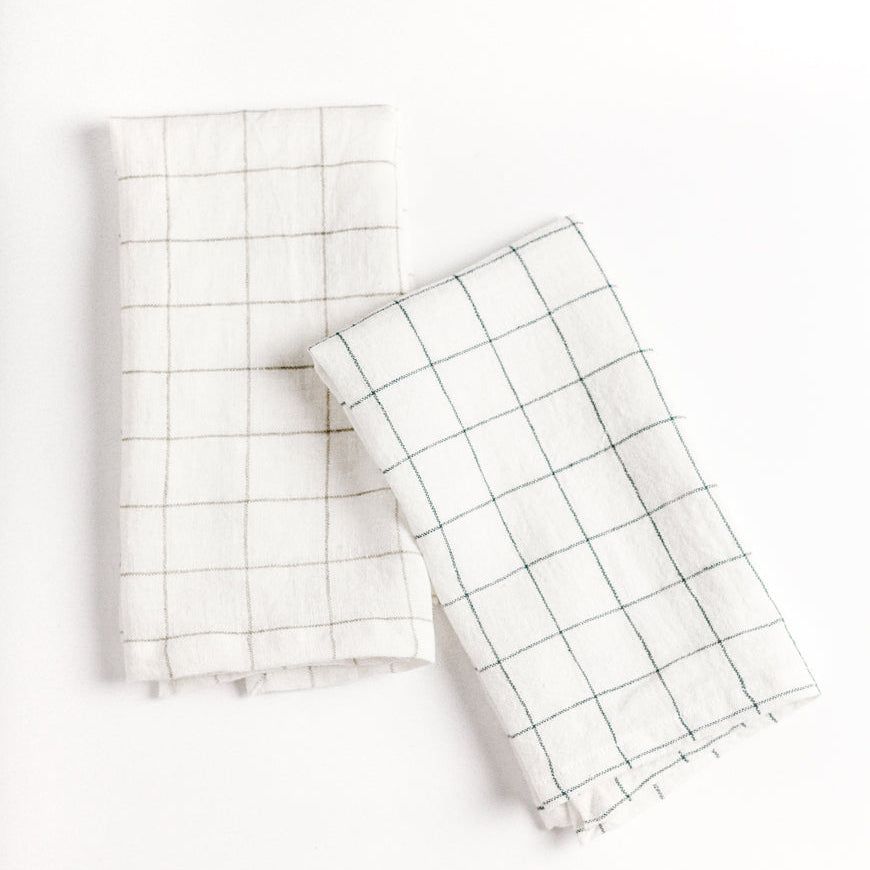 Two white checkered towels on a white background
