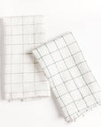 Two white checkered towels on a white background