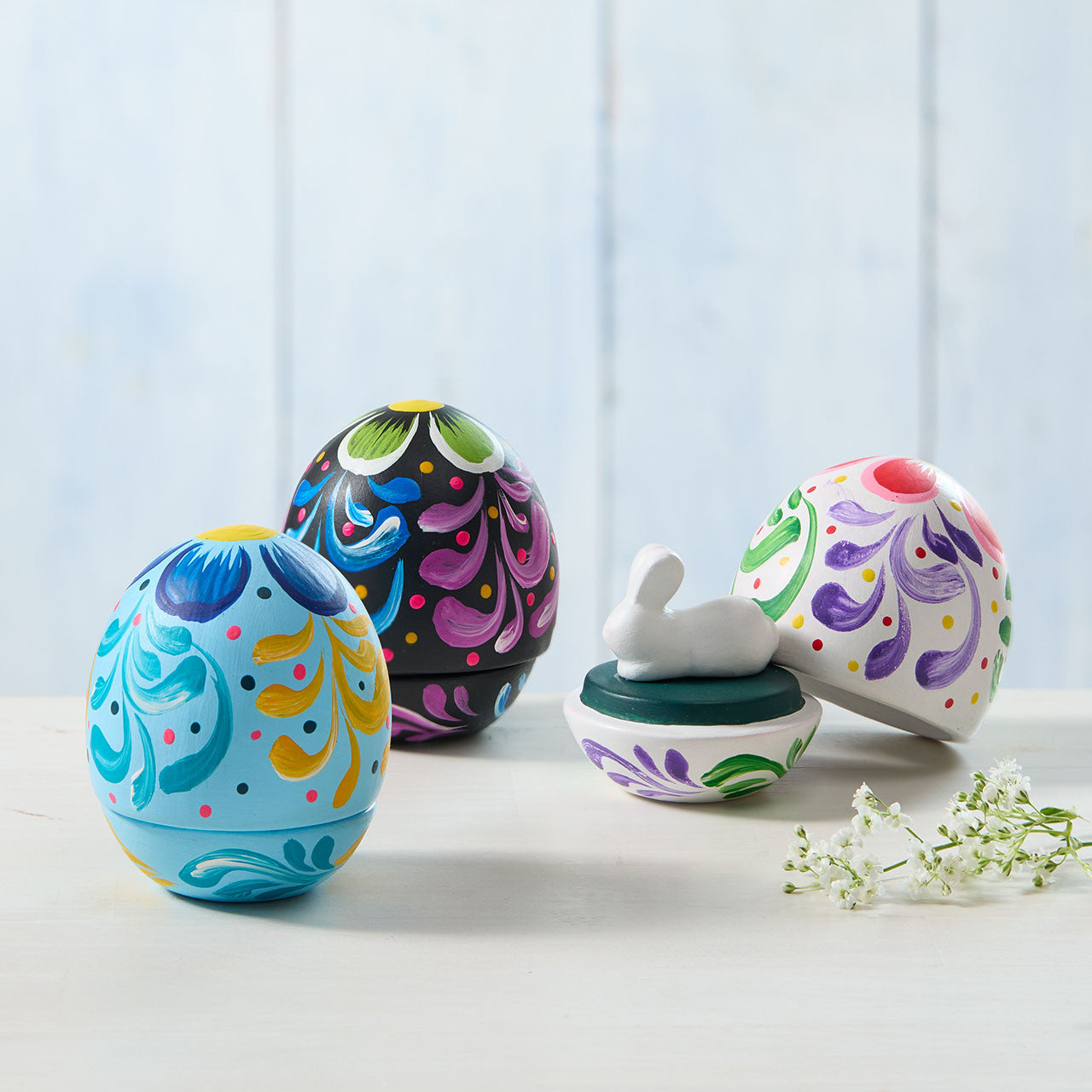 Colorful Easter eggs with floral patterns on a light background